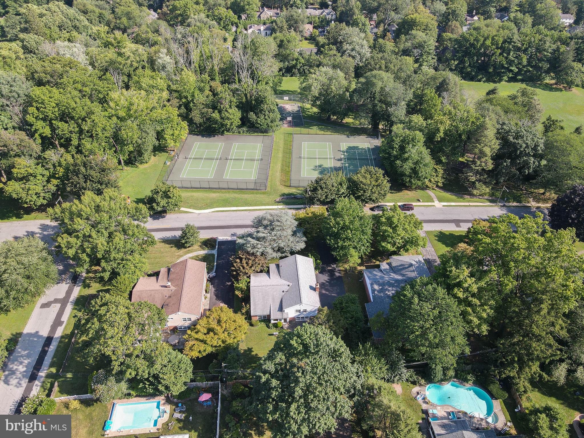 1205 Manoa Road Wynnewood, PA 19096 - Photo 7 of 44 Aerial view of the house, park, and tennis courts