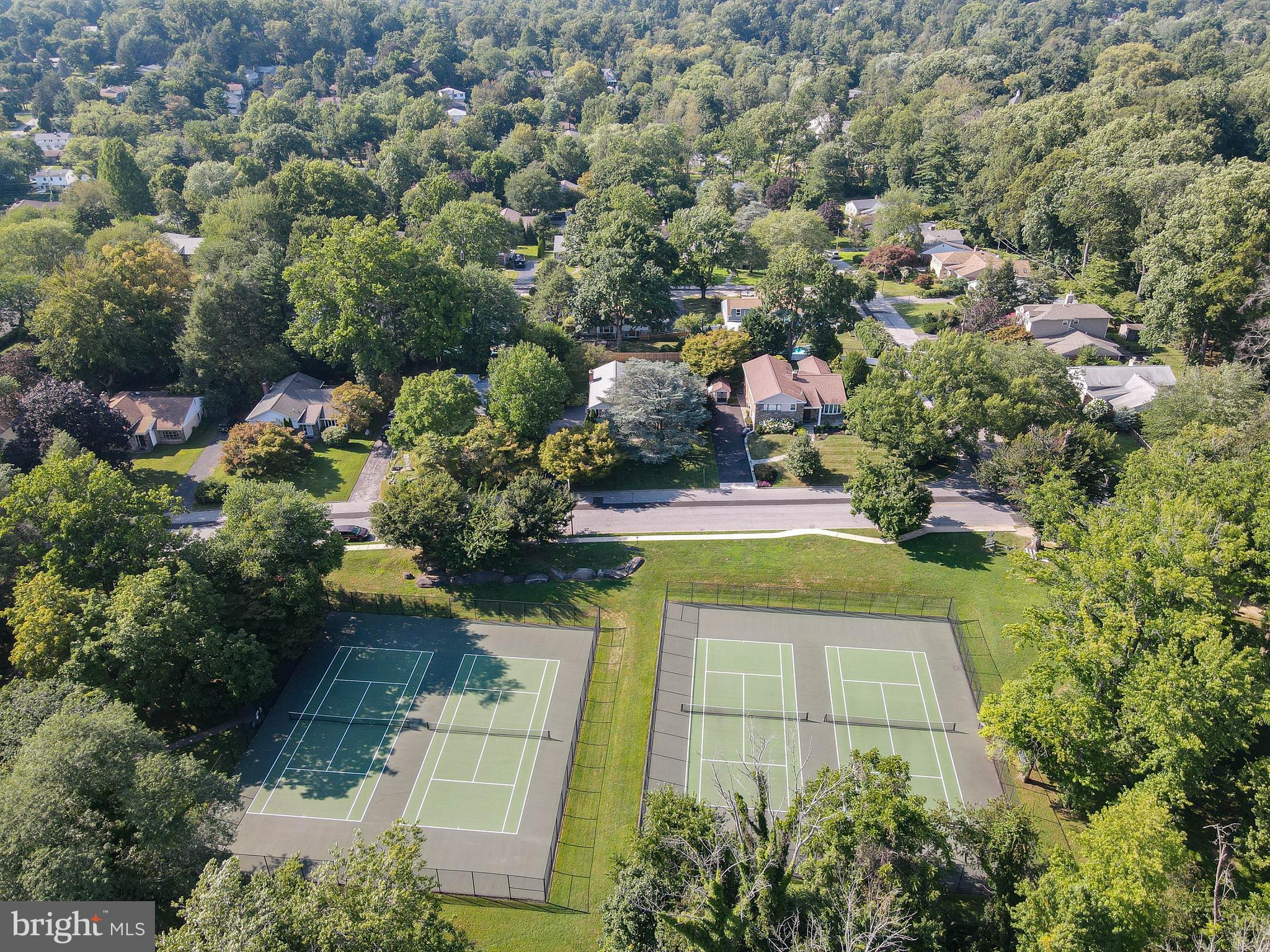 1205 Manoa Road Wynnewood, PA 19096 - Photo 8 of 44 Aerial view of tennis courts and neighborhood