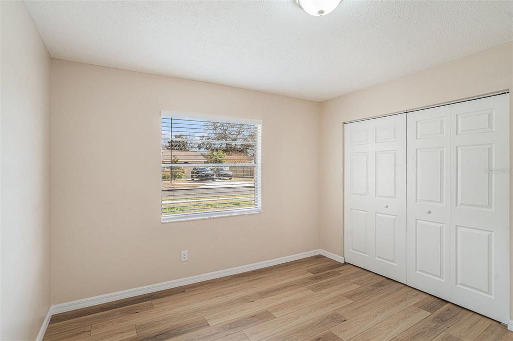 2527 Ridge Top Way Valrico, FL 33594 - Photo 20 of 29 an empty room with wooden floor and window