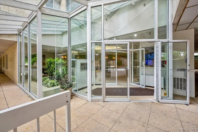 a sign that is in front of flowers