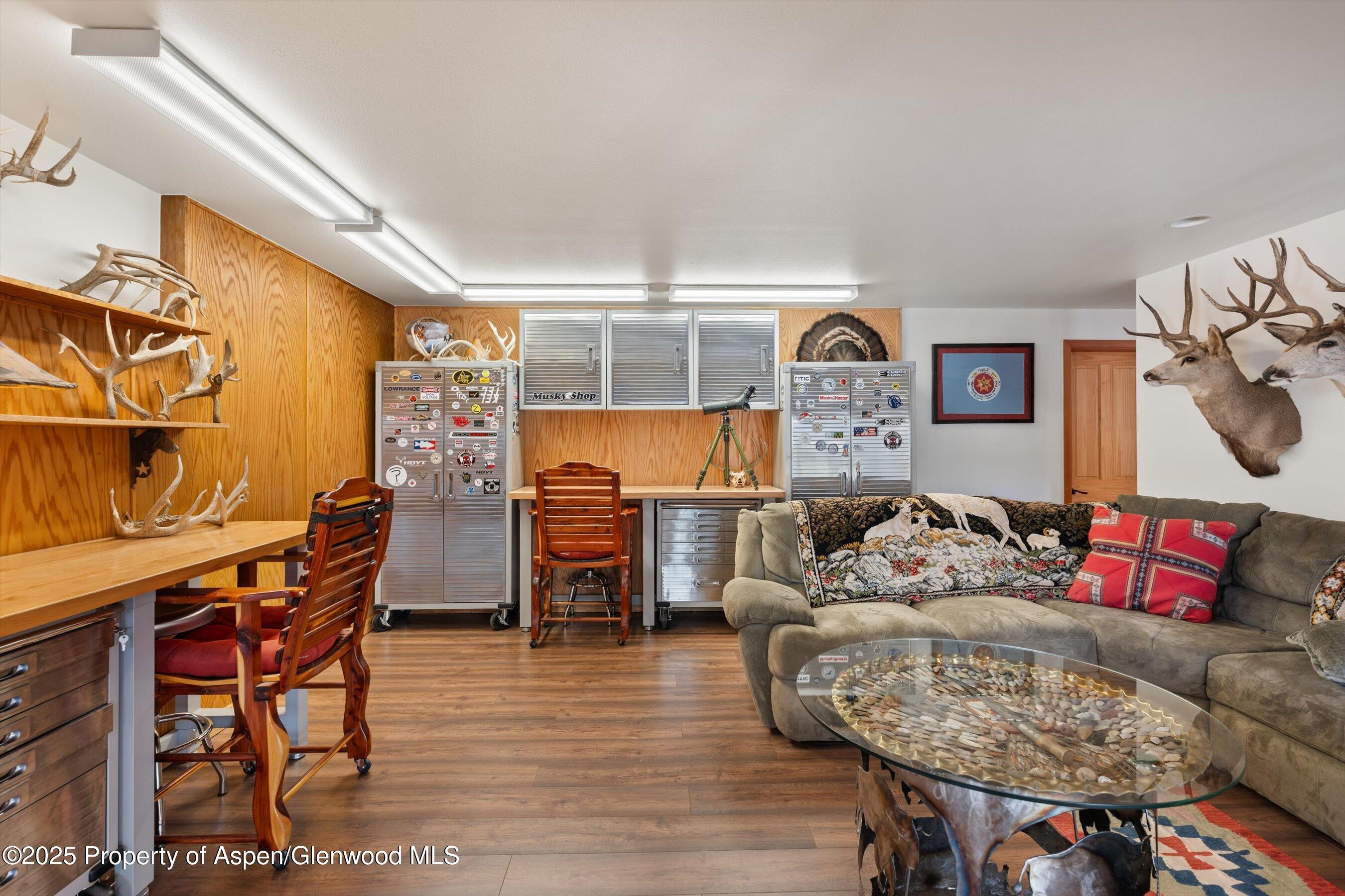 238 Hawk Lane Basalt, CO 81621 - Photo 36 of 46 a living room with furniture and a wooden floor