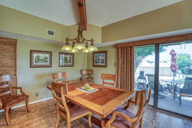 a view of a kitchen with a sink and cabinets