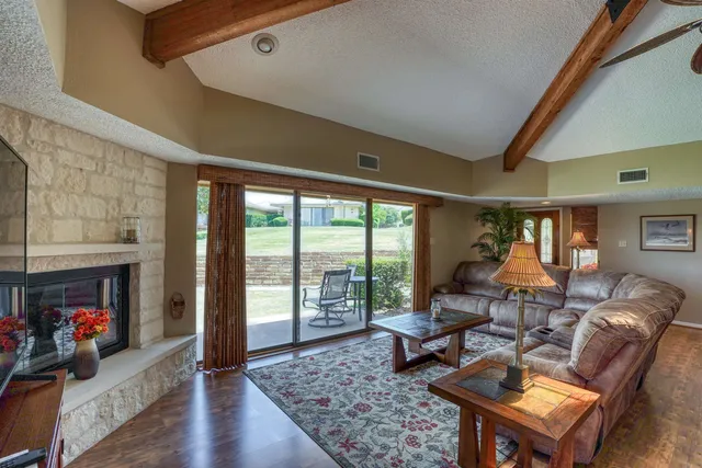 a view of a chairs and table in a patio
