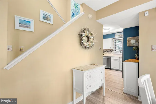 a kitchen with a sink a stove and cabinets