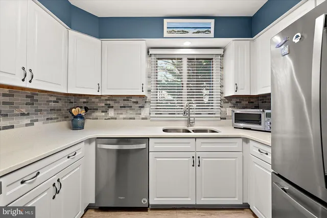a view of a kitchen with furniture and a window