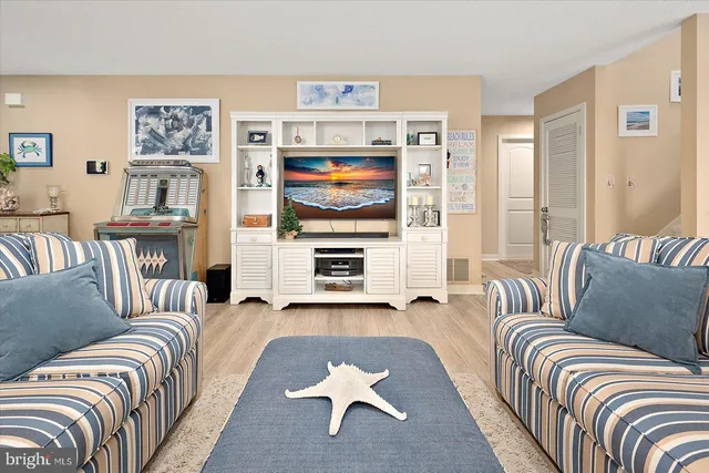 a bedroom with furniture and a flat screen tv