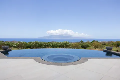 a view of a road with an ocean