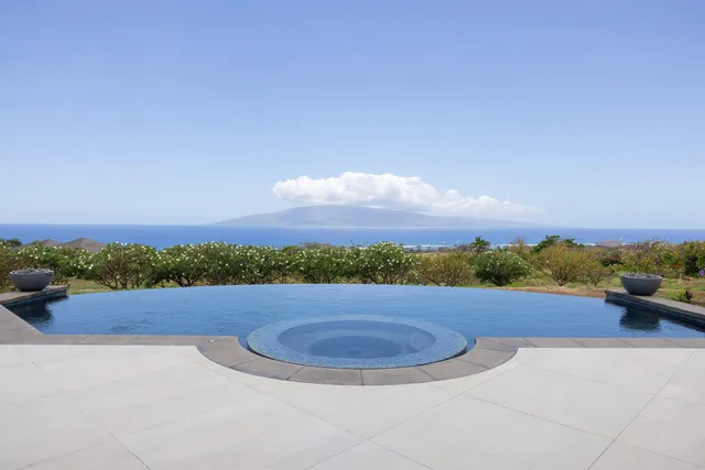 a view of a road with an ocean