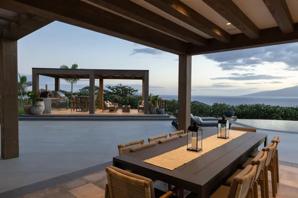 a view of a patio with a table chairs and a table