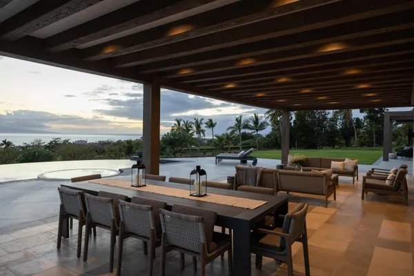a view of an outdoor space with furniture and garden view