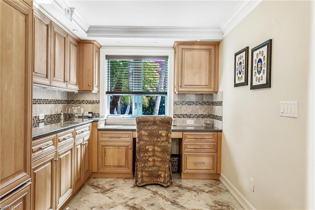 800 River Point Drive, Unit 319 Naples, FL 34102 - Photo 13 of 33 a kitchen with stainless steel appliances cabinets and a window