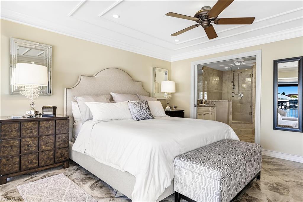 800 River Point Drive, Unit 319 Naples, FL 34102 - Photo 15 of 33 a bedroom with a bed and a dresser