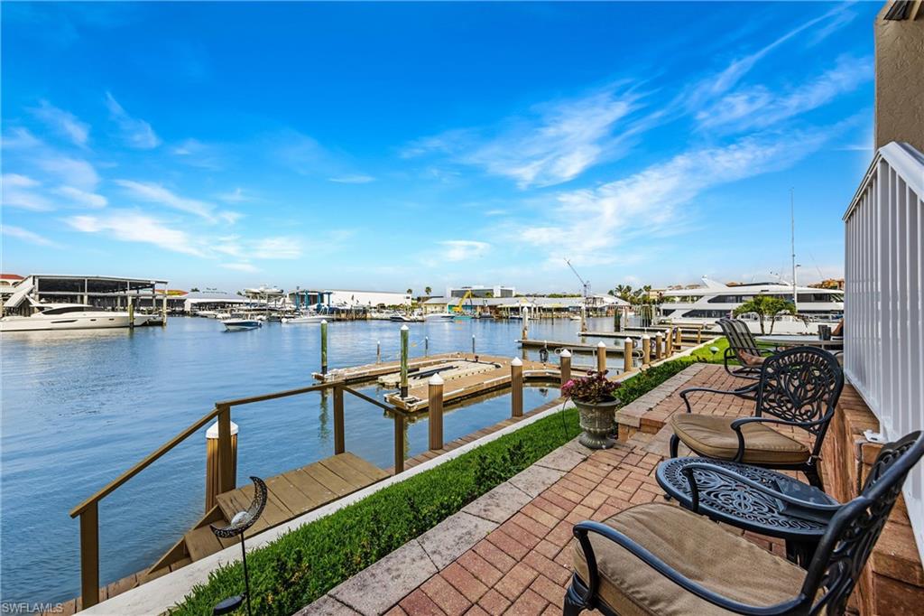 800 River Point Drive, Unit 319 Naples, FL 34102 - Photo 25 of 33 a view of a terrace with seating area