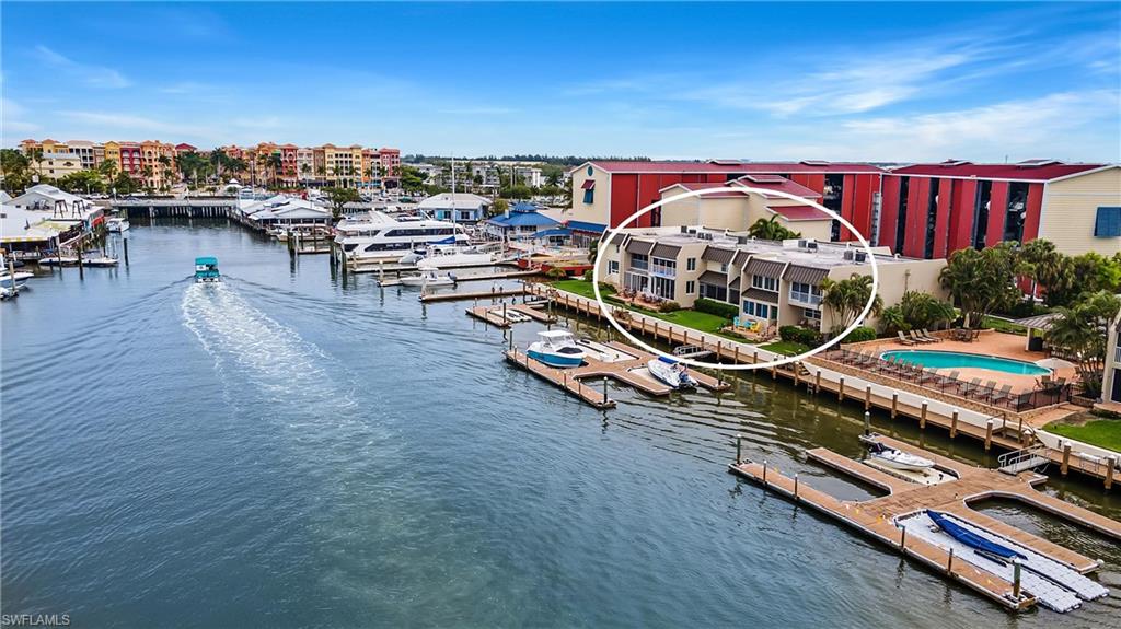 800 River Point Drive, Unit 319 Naples, FL 34102 - Photo 29 of 33 an outdoor space with furniture and stove