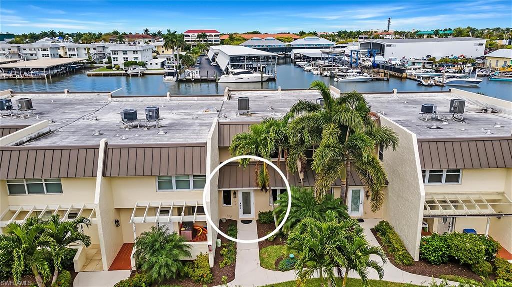 800 River Point Drive, Unit 319 Naples, FL 34102 - Photo 32 of 33 an aerial view of residential houses with outdoor space and lake view