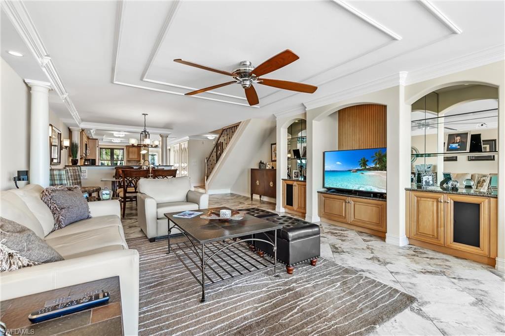 800 River Point Drive, Unit 319 Naples, FL 34102 - Photo 7 of 33 a living room with furniture and wooden floor