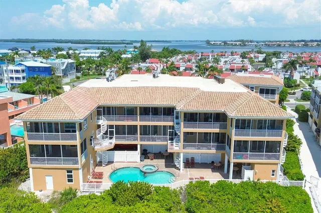 a dining room with furniture and floor to ceiling windows