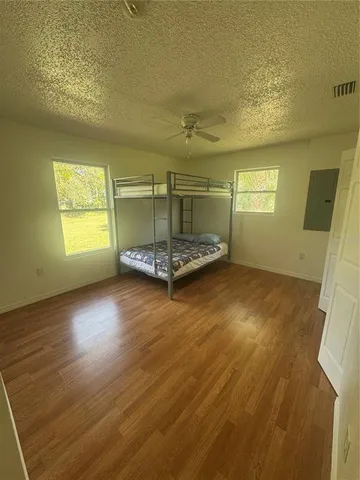 a bathroom with a sink and mirror with toilet