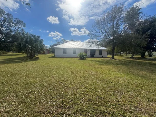 a view of a house with a big yard