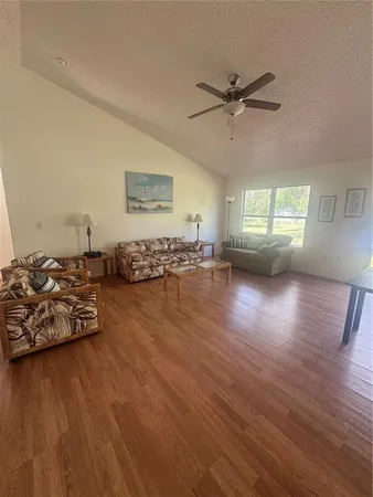 a view of a livingroom with furniture and wooden floor