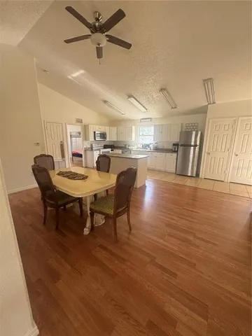 a view of a dining room with furniture