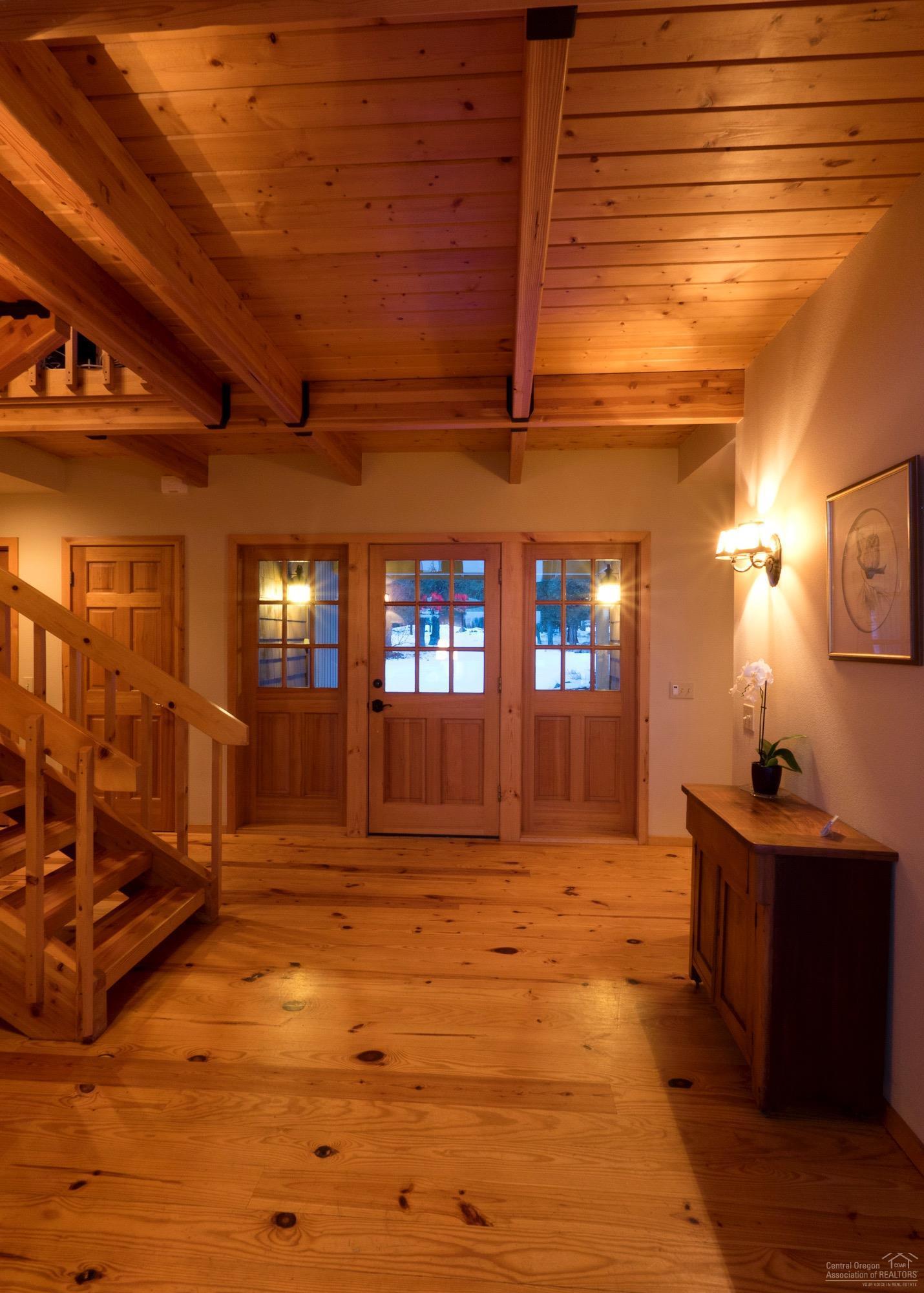 17231 Mountain View Road Sisters, OR 97759 - Photo 3 of 22 Warm wood and iron accents in entryway;