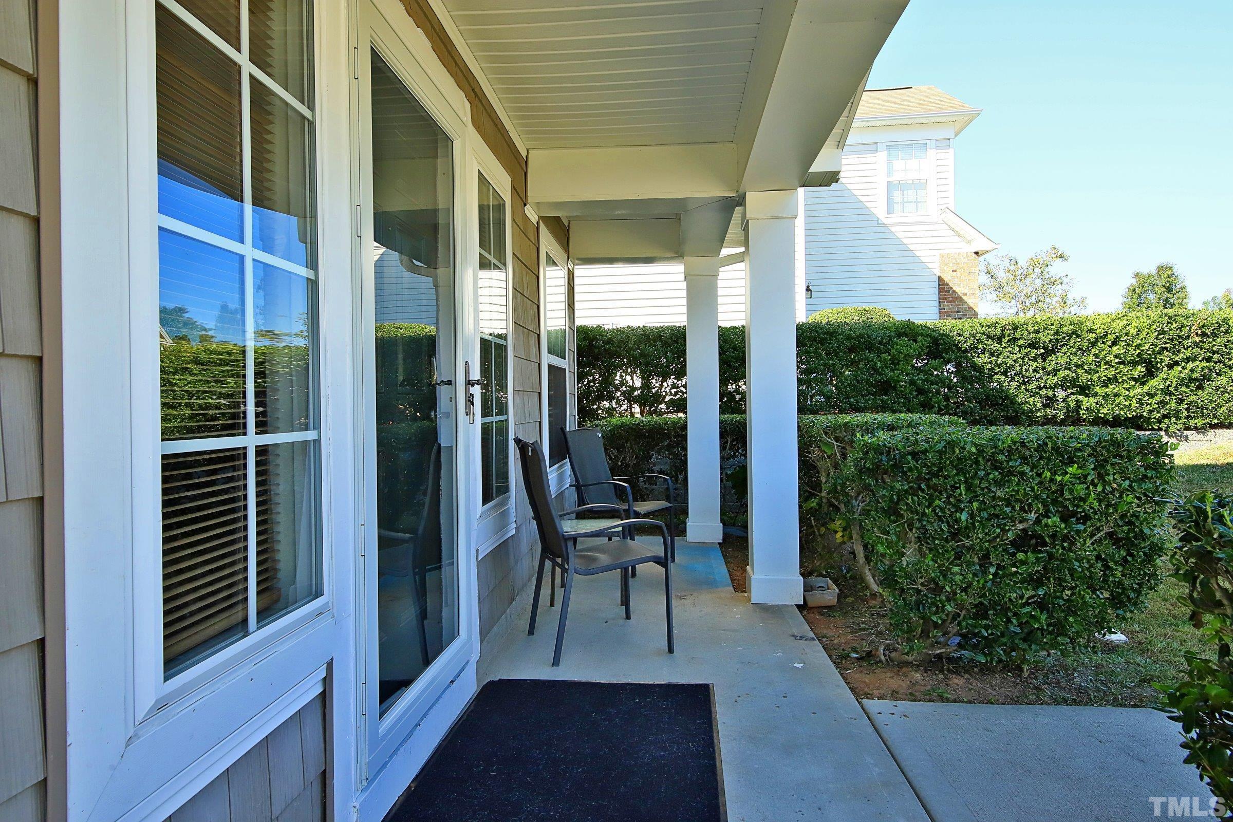 3816 Tryon Ridge Drive Raleigh, NC 27610 - Photo 2 of 28 a view of a balcony with chair and table