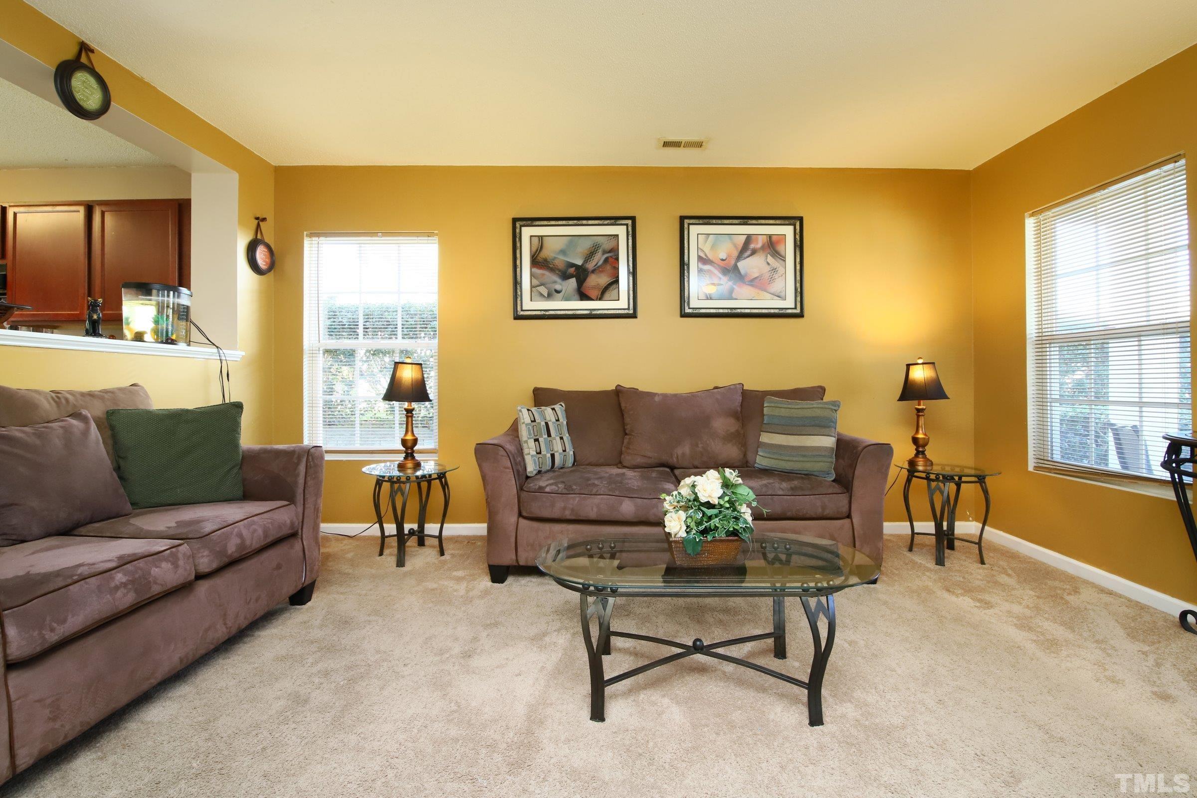 3816 Tryon Ridge Drive Raleigh, NC 27610 - Photo 11 of 28 a living room with furniture and a large window