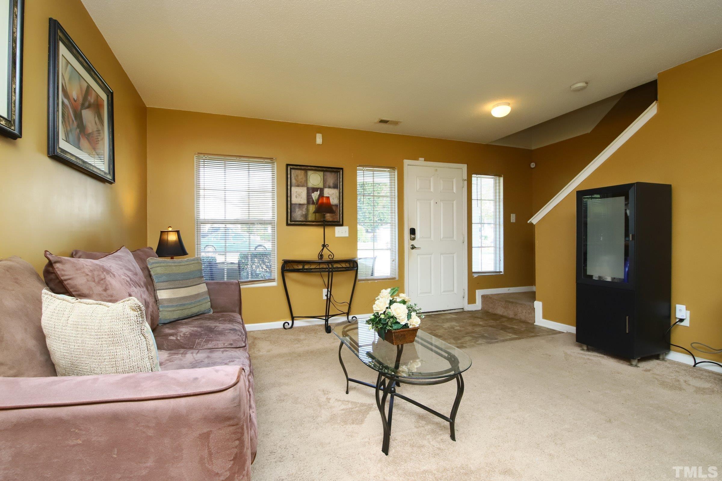 3816 Tryon Ridge Drive Raleigh, NC 27610 - Photo 13 of 28 a living room with furniture and a window