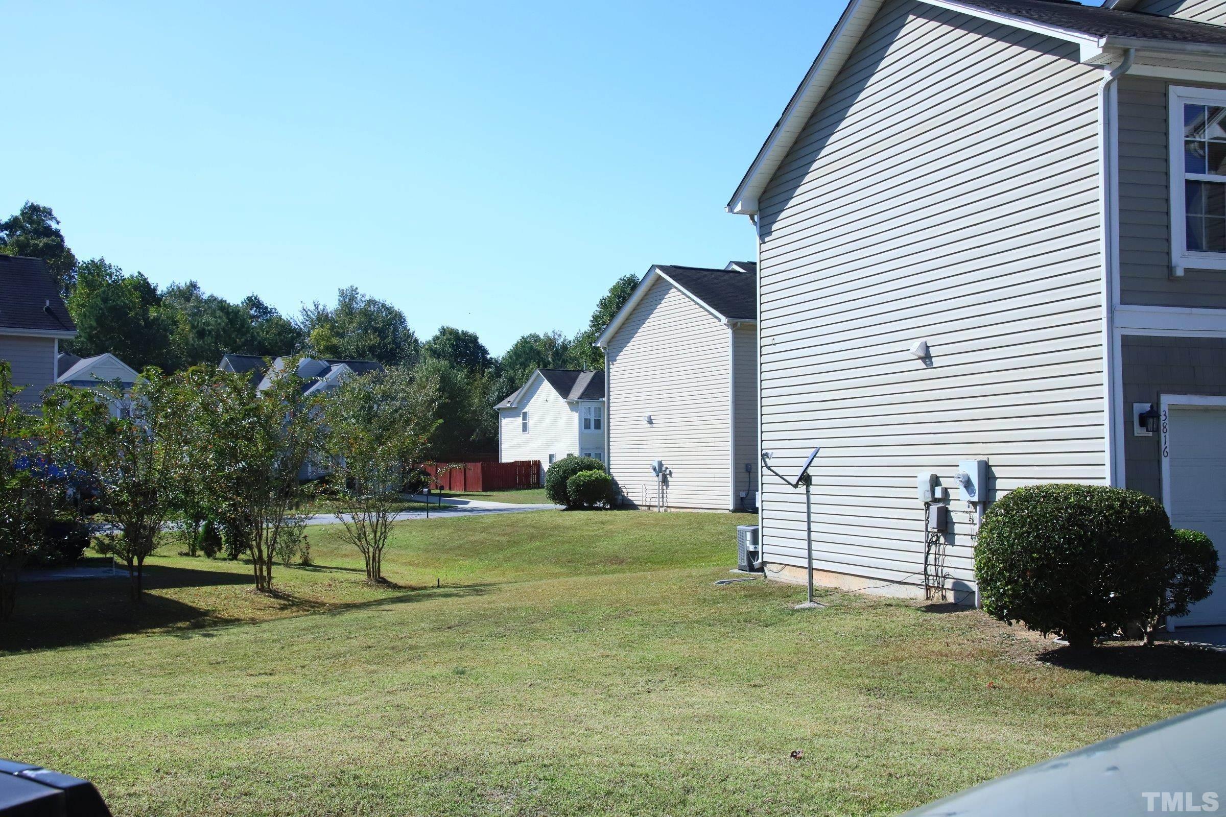 3816 Tryon Ridge Drive Raleigh, NC 27610 - Photo 3 of 28 a view of a house with a yard and a garage
