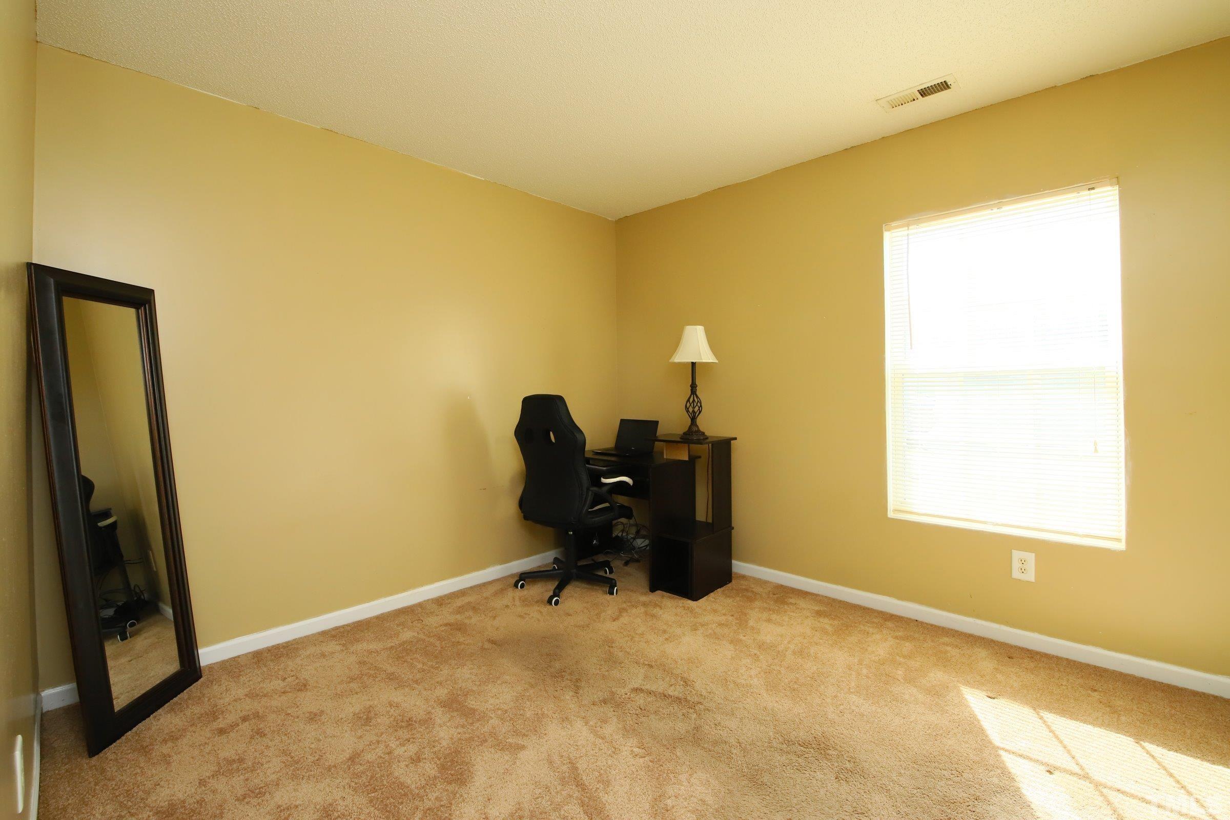 3816 Tryon Ridge Drive Raleigh, NC 27610 - Photo 25 of 28 a view of a room with a window