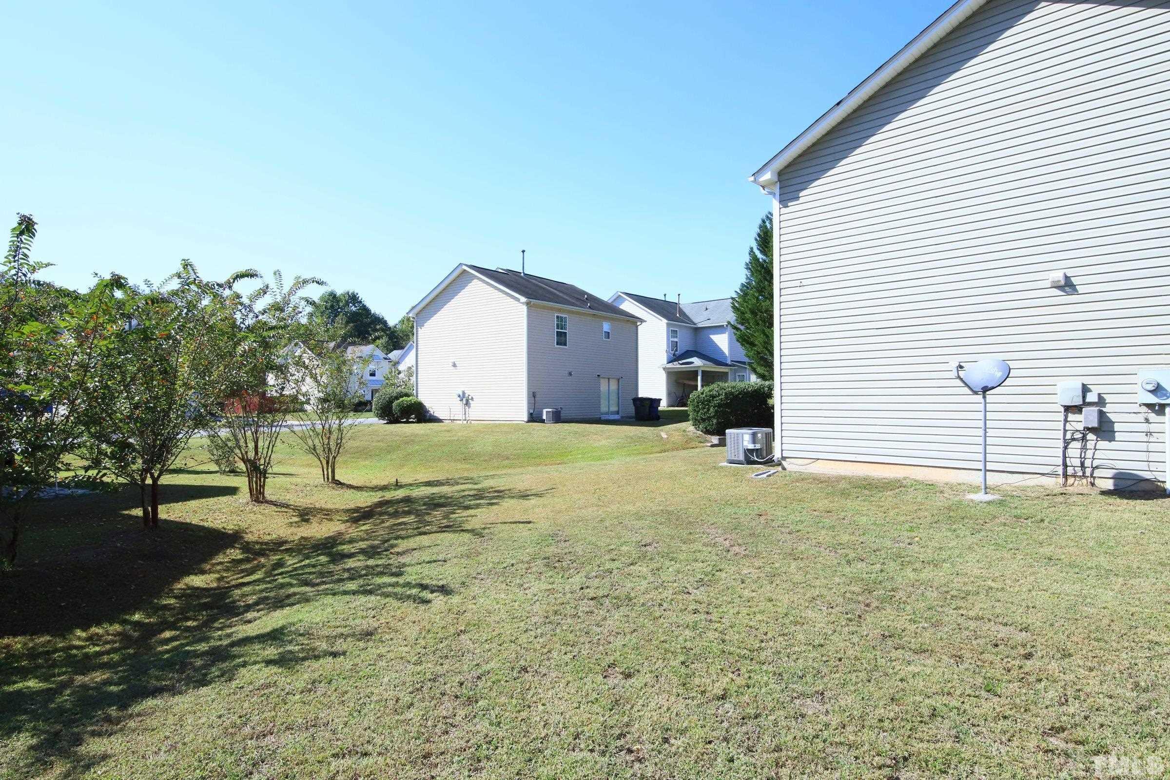 3816 Tryon Ridge Drive Raleigh, NC 27610 - Photo 4 of 28 a house with a yard
