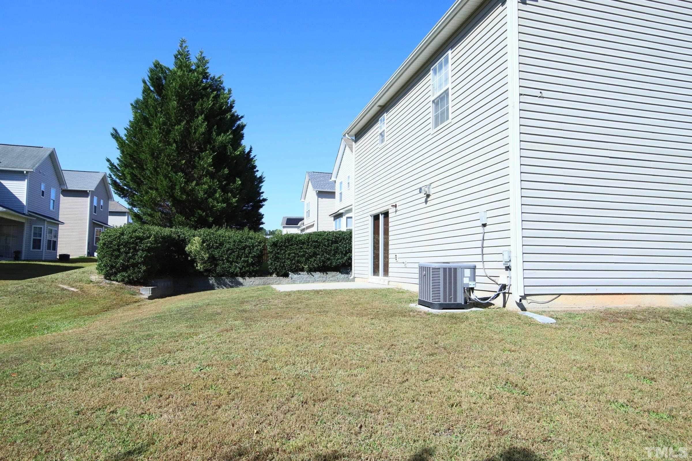 3816 Tryon Ridge Drive Raleigh, NC 27610 - Photo 5 of 28 a house view with a backyard space