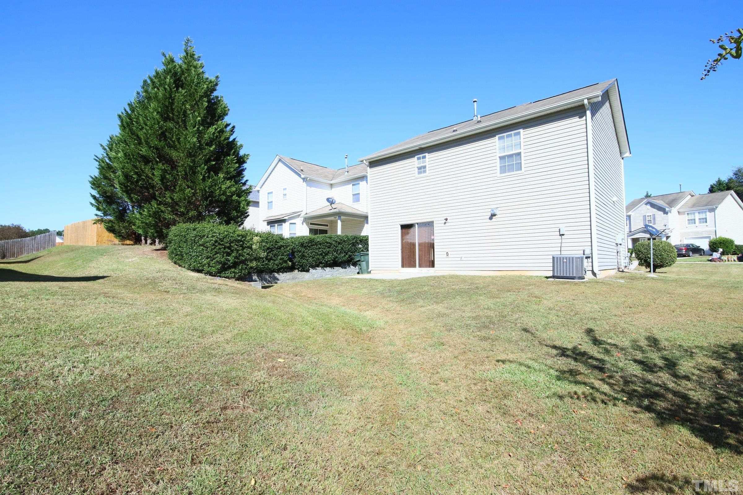 3816 Tryon Ridge Drive Raleigh, NC 27610 - Photo 6 of 28 a view of a big house with a yard
