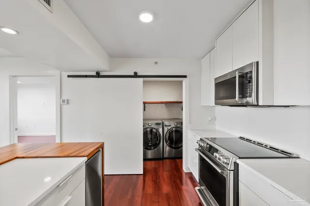 a kitchen with a stove and a refrigerator
