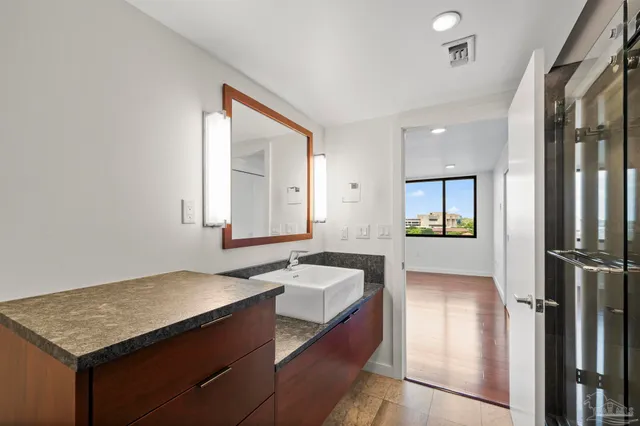 a bathroom with a sink and a mirror