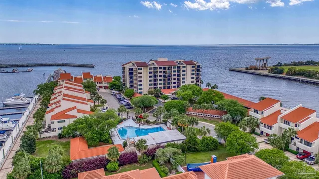 an aerial view of a house with a lake view