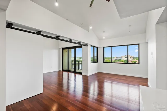 a view of an entryway with wooden floor