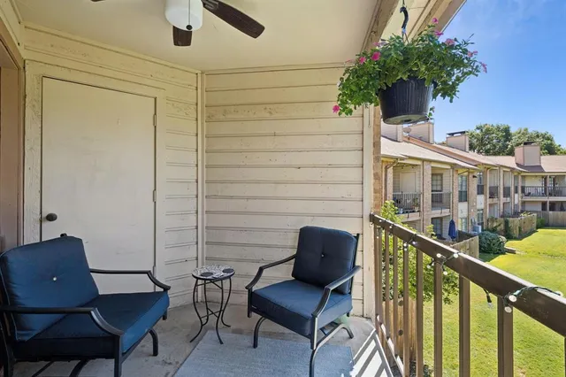 a view of balcony with seating area