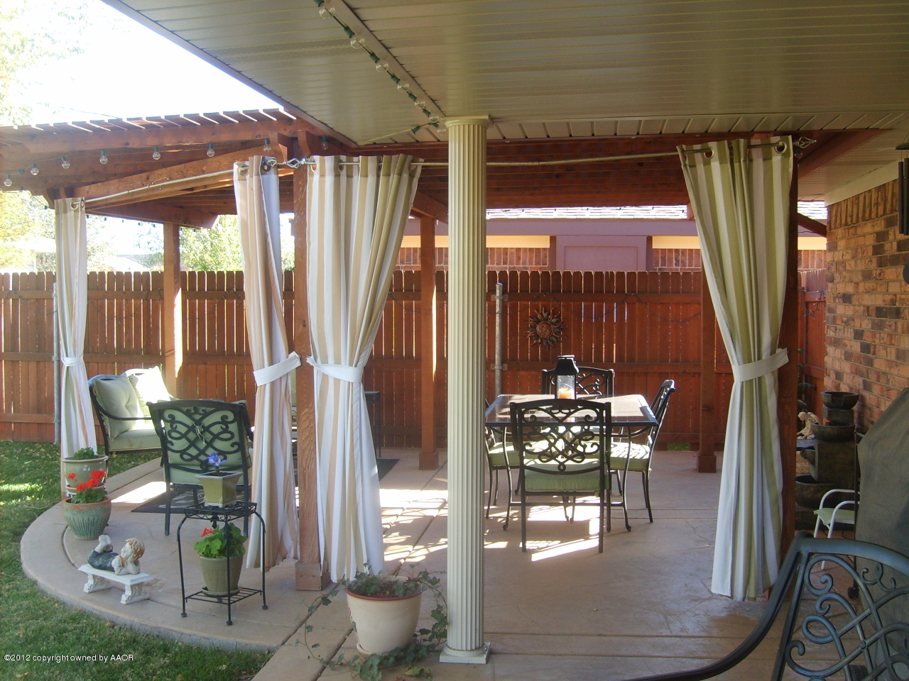 4814 Tulip Avenue Amarillo, TX 79110 - Photo 2 of 27 a dining room with wooden floor table and chairs