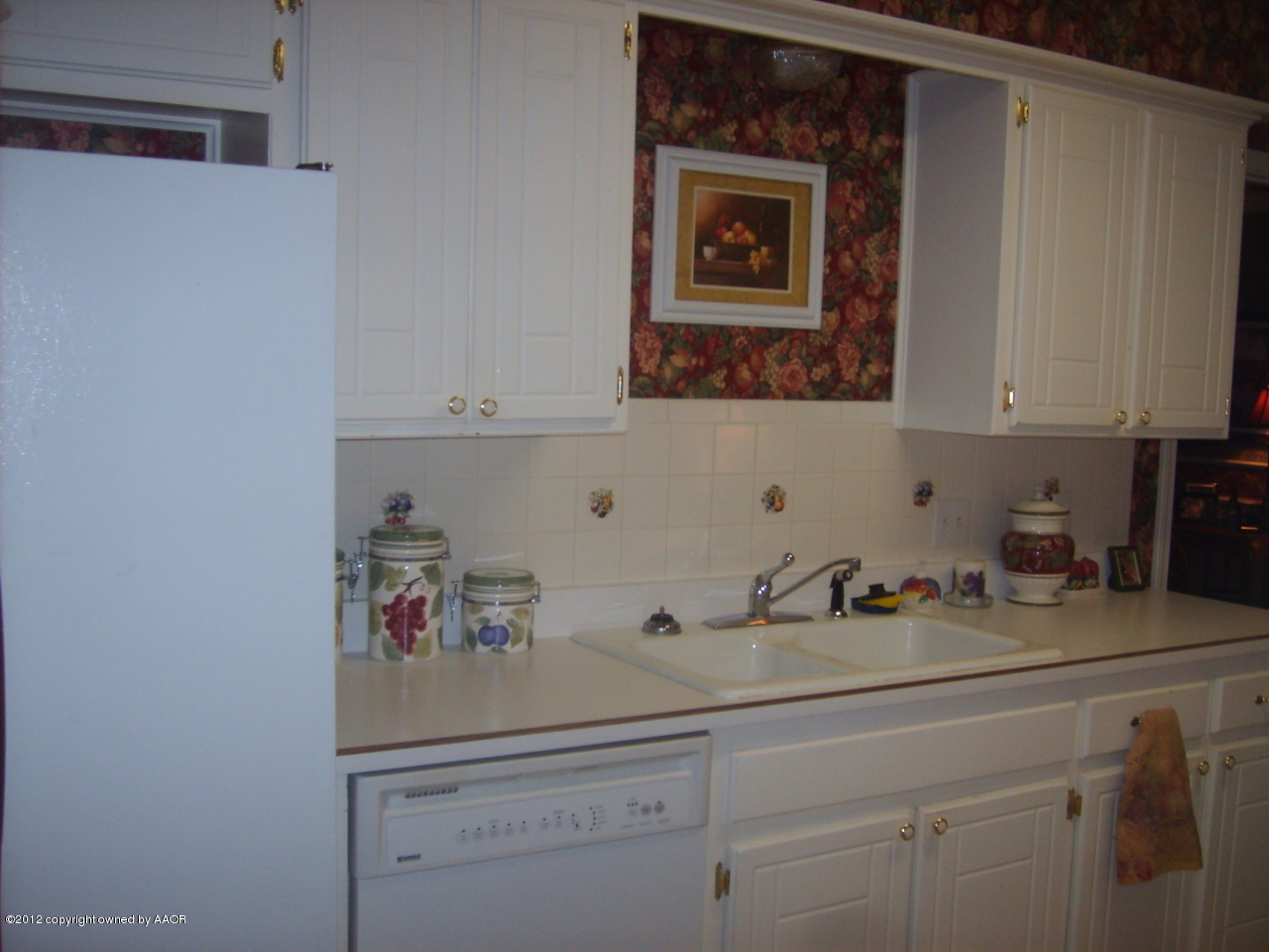 4814 Tulip Avenue Amarillo, TX 79110 - Photo 11 of 27 a kitchen with a sink and cabinets