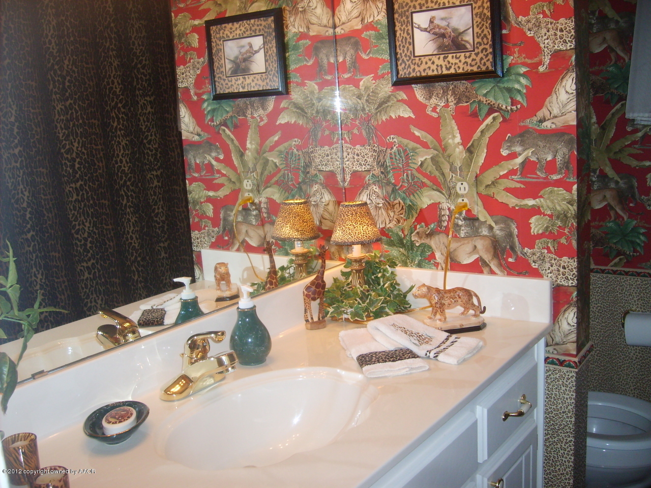 4814 Tulip Avenue Amarillo, TX 79110 - Photo 15 of 27 a bathroom with a sink and a mirror