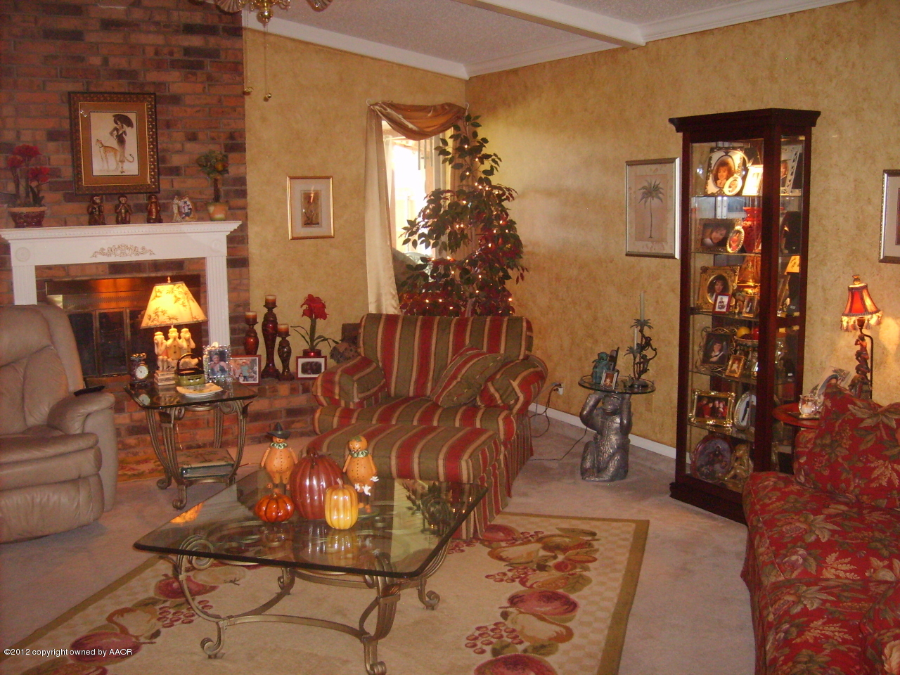 4814 Tulip Avenue Amarillo, TX 79110 - Photo 3 of 27 a view of a living room with furniture and a fireplace