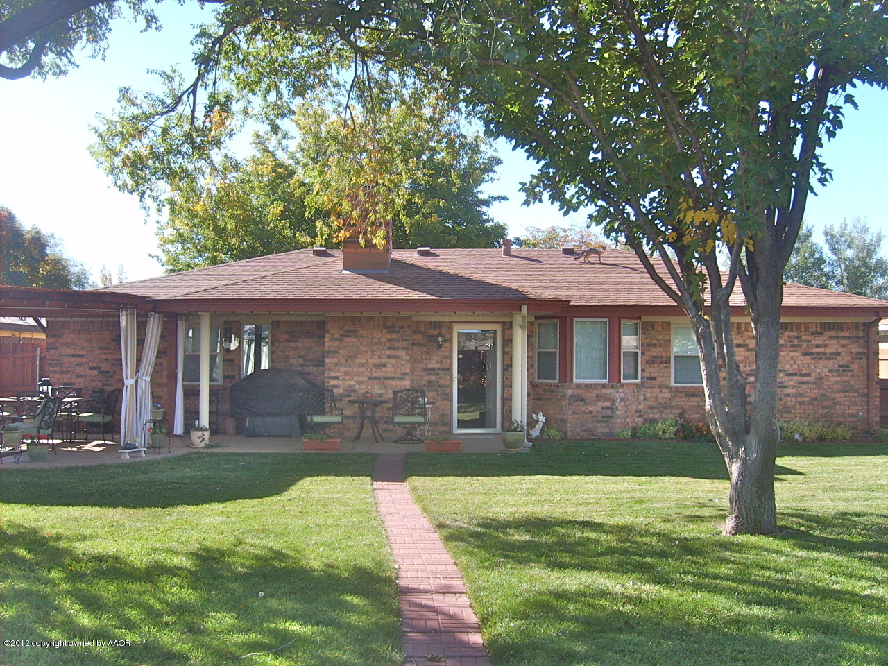 4814 Tulip Avenue Amarillo, TX 79110 - Photo 22 of 27 a front view of a house with a yard