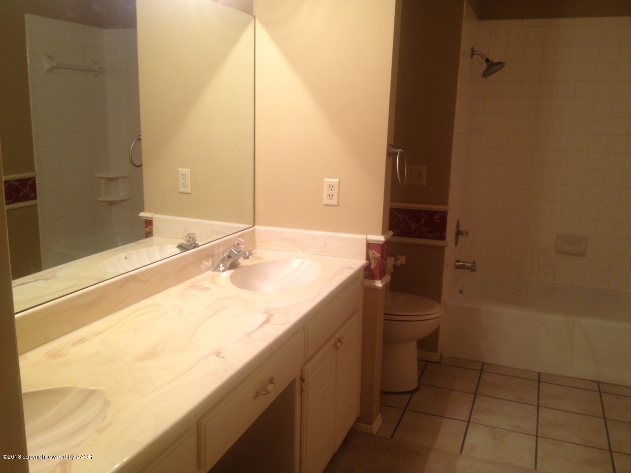 4814 Tulip Avenue Amarillo, TX 79110 - Photo 8 of 27 a bathroom with a granite countertop sink and a mirror