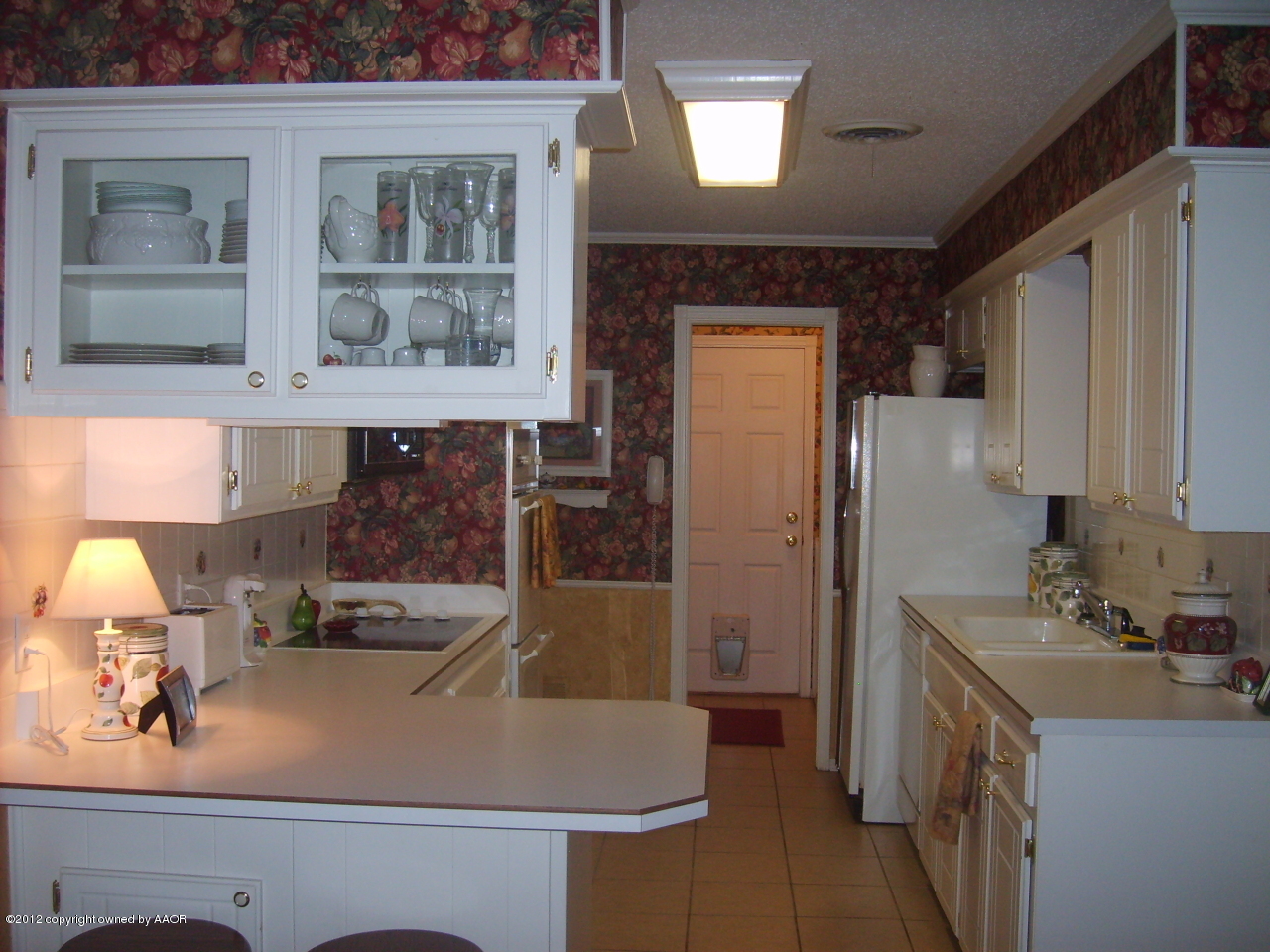 4814 Tulip Avenue Amarillo, TX 79110 - Photo 9 of 27 a bathroom with a sink and a mirror