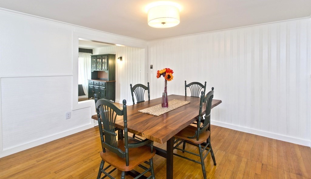 520 Dutchess Street Springfield, MA 01129 - Photo 12 of 31 a view of a dining room with furniture and wooden floor