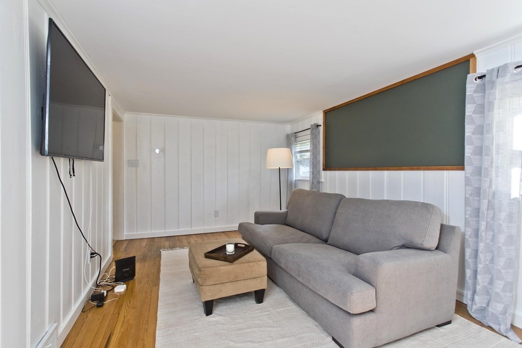 520 Dutchess Street Springfield, MA 01129 - Photo 17 of 31 a living room with furniture and a flat screen tv