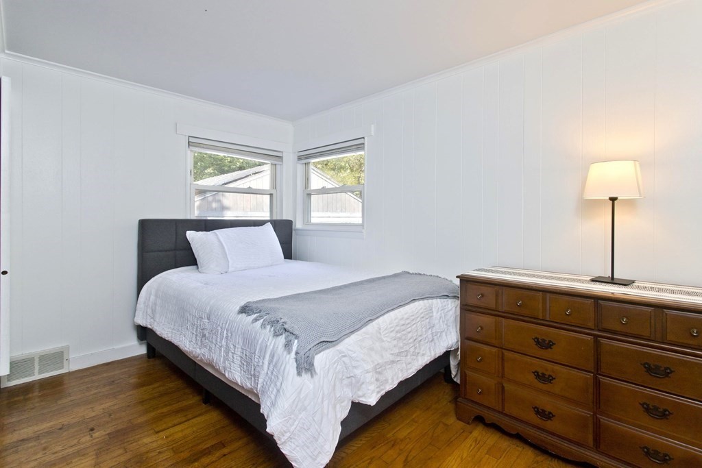 520 Dutchess Street Springfield, MA 01129 - Photo 22 of 31 a bedroom with a bed and a lamp