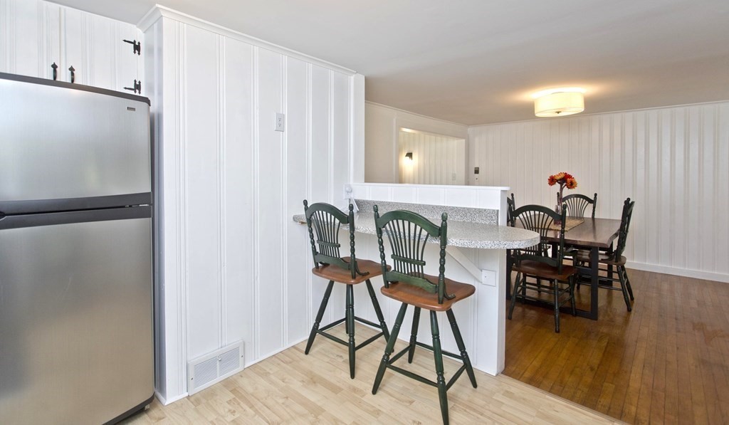 520 Dutchess Street Springfield, MA 01129 - Photo 7 of 31 a view of a dining room with furniture and wooden floor